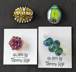 lot 64 image: Four Art Glass Beads