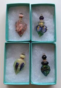 lot 80 image: Four Lampwork Glass Essential Oil Pendants