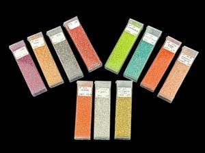 lot 194 image: 11 Tubes of Beads in Light Topaz, Salmon, Peach, Orange and More