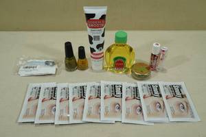 lot 203 image: Self Care Products -Eye Patches, Lotion, Oil, Nail Clippers, Nail Polish, Lip Balm