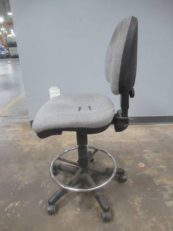 lot 63 image: Office Chair on casters with adjustable Height - Some Staining on Upholstery, Used in Warehouse, SOLD AS IS.