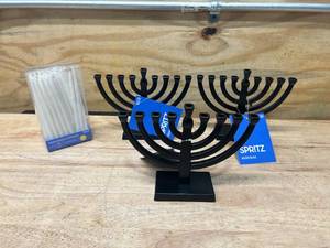 lot 92 image: SPRITZ Lot of 3 Menorahs (black) with a box of white candles (45 count)
