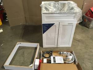 lot 34 image: Glacier Bay All-in-One Stainless Steel 24 in Laundry Sink with Faucet and Storage Cabinet in White, Customer returns, review all pictures