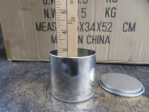lot 42 image: NEW CASE OF ILLUME TIN CANS WITH LIDS.