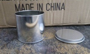 lot 43 image: NEW CASE OF ILLUME TIN CANS WITH LIDS.