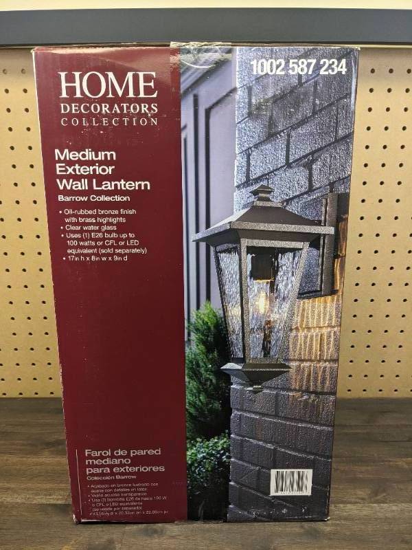 lot 79 image: New Home Decorators Collection 1-Light Oil Rubbed Bronze with Gold Highlights Outdoor 8 in. Wall Lantern Sconce with Clear Water Glass
