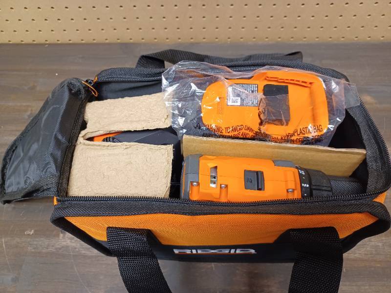 lot 106 image: RIDGID 18V Cordless 2-Tool Combo Kit with 12 in. DrillDriver, 14 in. Impact Driver, (2) 2.0 Ah Batteries, Charger, and Bag