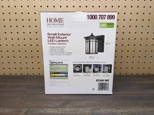 lot 140 image: New Home Decorators Collection Antique Bronze Outdoor LED Wall Lantern Sconce