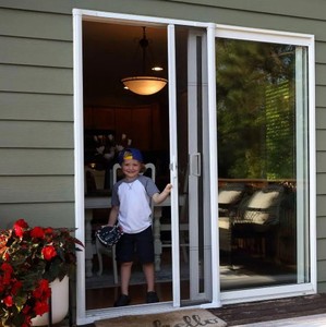 lot 51 image: New 80 in. Brisa White Retractable Screen Door for Sliding Door by Weather Star