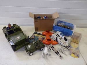 lot 83 image: Lot of Assorted Toys Gi Joe MegaBlocks Star Wars Taun Taun and More Plastic Tote Included