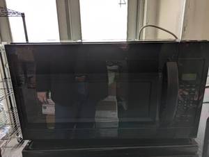 lot 45 image: Whirlpool over the counter microwav...