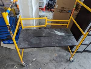 lot 34 image: Metal scaffold platform on wheels