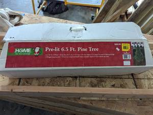 lot 54 image: Prelit 6.5 Christmas tree...