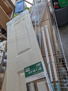 lot 91 image: Bi-fold door, shower rods and shelv...