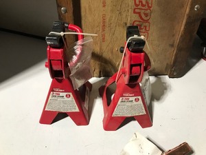 lot 14 image: 2 jack stands, battery jumper cables and 2 creepers