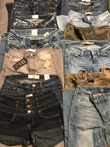 lot 97 image: 13 pair of jeans, 2 pairs of shorts and 1 Nike leggings