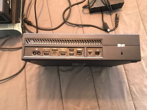 lot 139 image: PlayStation 4 console, 2 Xbox 360 consoles, Xbox console, Xbox controller, power cable, HDMI cable and some sort of power pack for Xbox 1