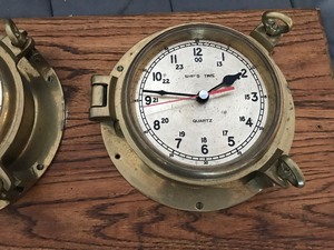 lot 140 image: Vintage brass ships barometer and clock Mounted on a piece of wood for display