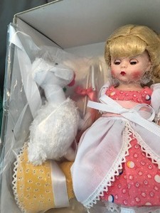 lot 153 image: MADAME ALEXANDER LITTLE BO PEEP DOLL 42570. Never been taken out of the box. Still fastened to the inside of the box