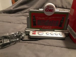 lot 354 image: Coca Cola alarm clock and FM radio