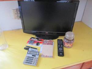 lot 44 image: Flat screen AOC TV with remote, cal...
