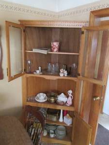 lot 47 image: All content of cabinet including cut glassware, stoneware, milk glass, brass and other nik naks