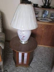lot 67 image: Round wood side table with storage....