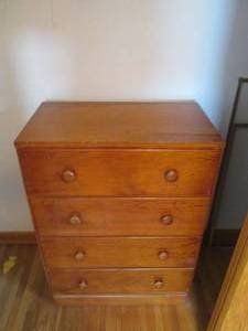 lot 88 image: Mid Height 4-drawer wood dresser....