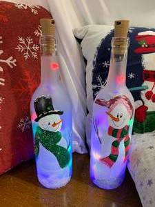 2 lighted Painted Snowman Bottles