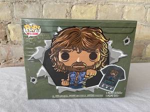 lot 24 image: FUNKO Pop Chuck Norris Pop Figure and Shirt Box Set.