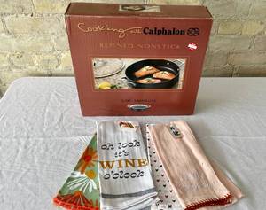 lot 76 image: Calphalon 5 quart Nonstick Saucepan With Lid and Hand Towels