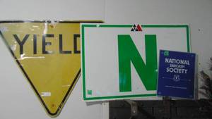 lot 6 image: 3 Metal Signs, Yield, Warehouse N, and Other