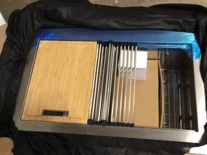 lot 20 image: Glacier Bay Zero Radius Farmhouse Apron-Front 18G Stainless Steel 33 in. Single Bowl Workstation Kitchen Sink, Spring Neck Faucet, Customer return, review all pictures
