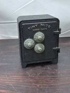 lot 105 image: Vintage Bulls-Eye Tiny Mite Bank-Safe By Arrow