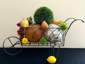 lot 29 image: Fun Decorative Metal Wheelbarrow with Faux Florals and Fruit