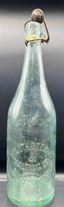 lot 205A image: Vintage Embossed Glass Bottles