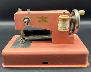 lot 240 image: Vintage Pink Casige  Miniature Toy Sewing Machine Western Germany