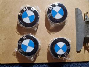 lot 1807 image: Lot of (4) BMW Wheel Center Caps (in original packaging)