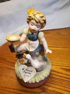 lot 1856 image: Girl and Duck theme Ceramic Musical Figurine