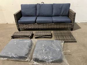 lot 47 image: Mars Gray 3-Piece Outdoor Rattan Wicker Patio Set, Sofa and Two Ottomans with Denim Blue Cushions.