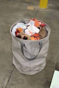 lot 584 image: Misc. Baby Toys and Clothes with Soft Side Storage Crate