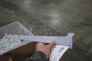 lot 490 image: Lot of (40) 12-12 Slatwall Shelf Brackets