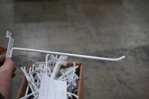 lot 492A image: Lot of (120) 10-12 Slatwall Hangers