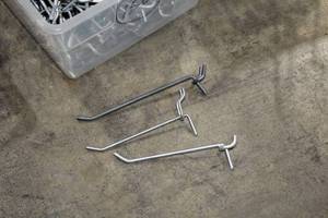 lot 497C image: Lot of (150) 7 Pegboard Hangers