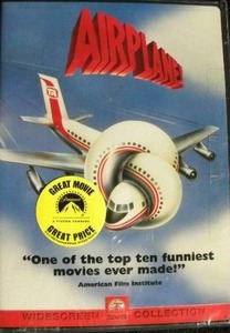 lot 211 image: Sealed VHS and DVD Lot original Airplane Movie & Top Gun Story & Drag Racing Classics plus much more
