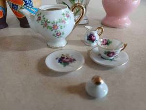 Vintage Pieces Four Ornate Vases, Miniature Tea Pieces, and an Ornate Saucer, and a 10-inch Tall Vase with an Asian Design