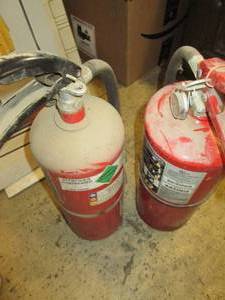 2 fire extinguishers 1 full 1 not f...