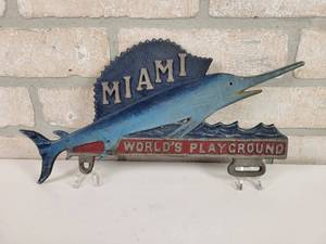 lot 149 image: Vintage Cast Aluminum MIAMI FL Swordfish License Plate Topper - Approx. 12 x 6
