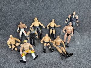 lot 2063 image: Lot of (10) Vintage WCW, WWE Wrestling Figures From 1997-2001 - JAXX Pacific, Titan Sports, Toy Biz, and More