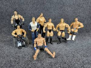 lot 2064 image: Lot of (10) Vintage WCW, WWE Wrestling & MMA Figures From 2003-2009 - JAXX Pacific, Titan Sports, and More